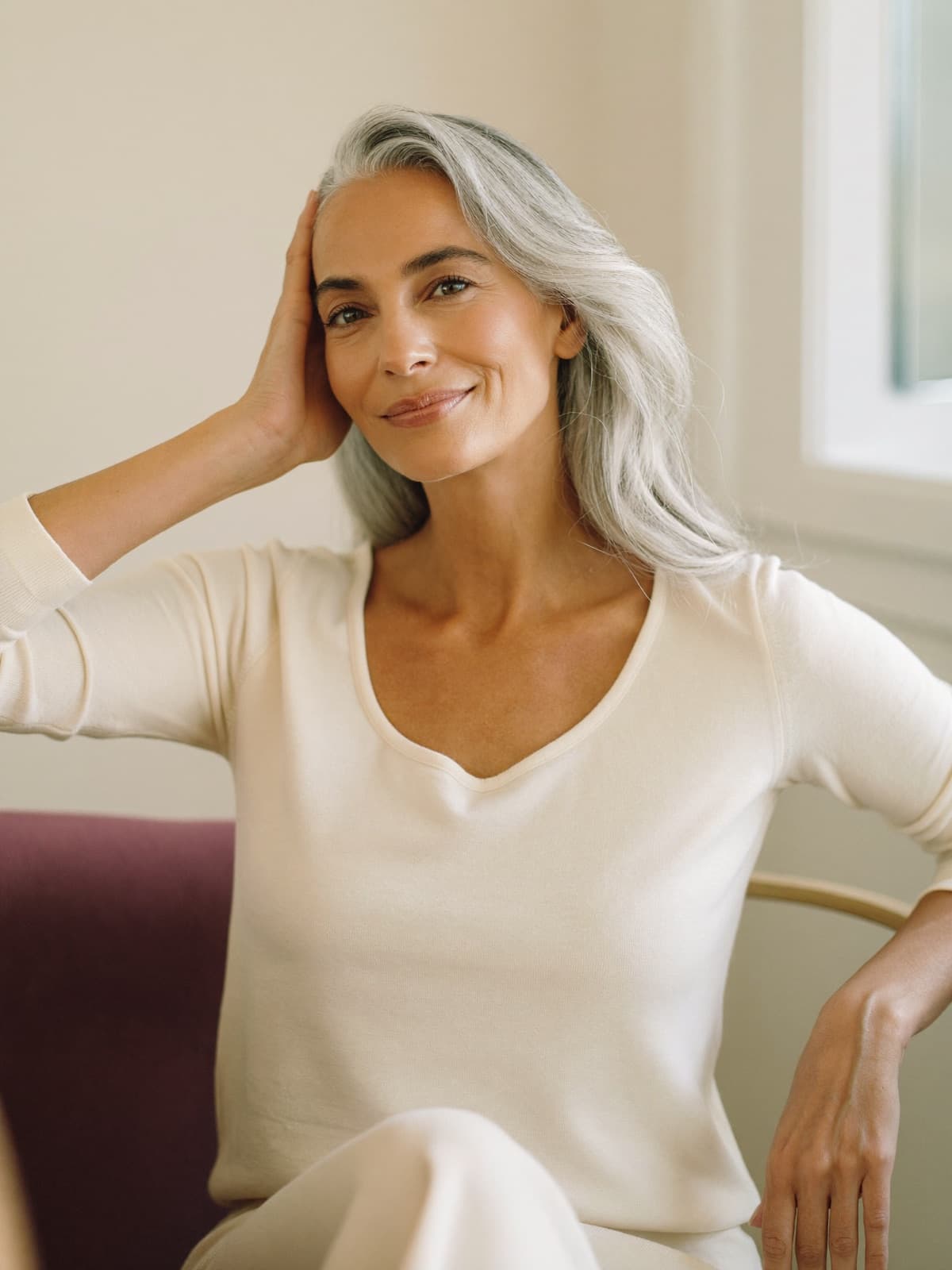 A woman in her fifties in soft natural light